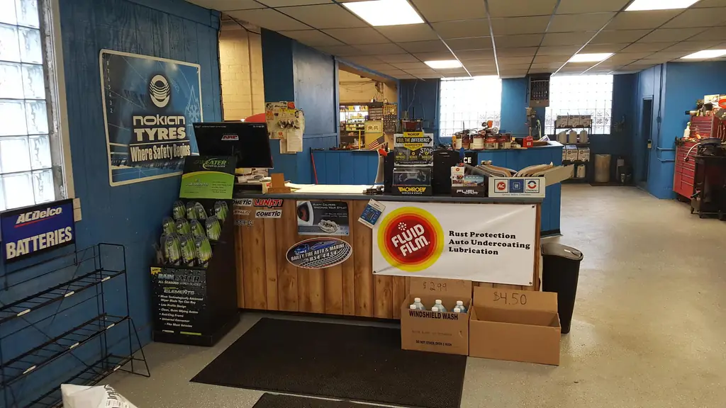 The Bailey Tire retail counter with a Nokian Tyres poster and the shop's own oval logo sticker